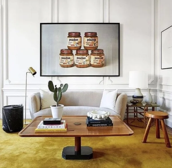 Think of your art and furniture as one scene, that you see in one frame - not with a big gap between them. Gold carpet glory by Isabel Lopez Quesada. 
