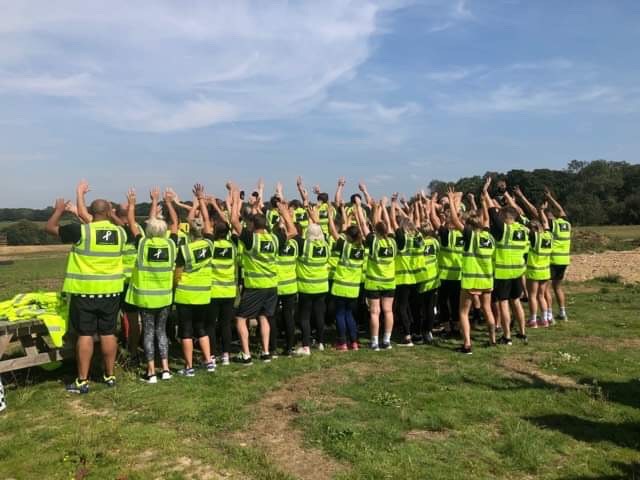 Participants wearing hi-vis jackets with Grace’s name on the back together with the White Ribbon logo.