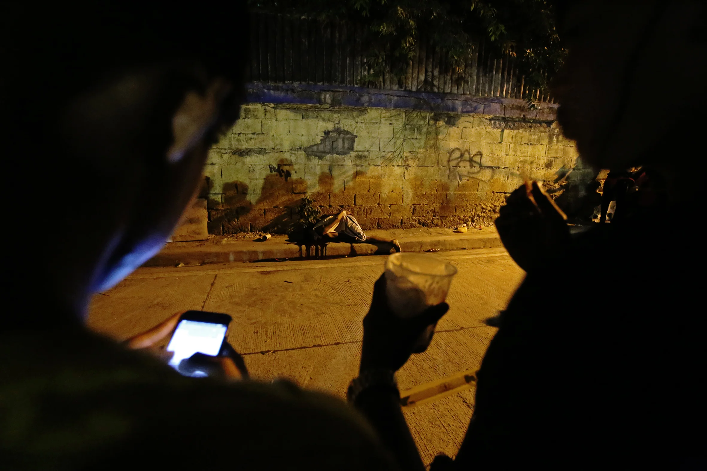  A victim of a summary execution is dumped on a sidewalk in Mandaluyong on the night of October 24, 2016.  