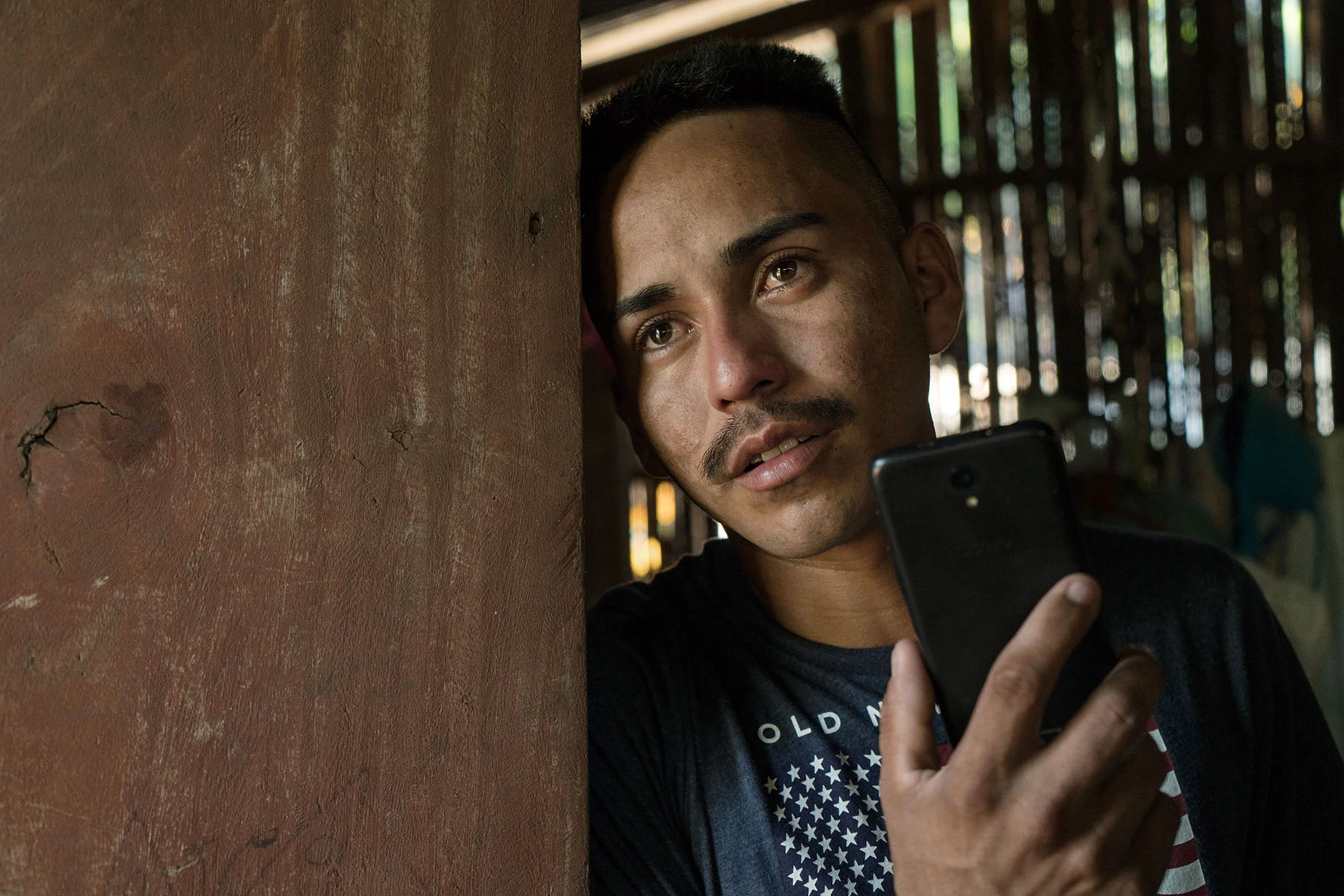 Arnovis Guidos Portillo talks to his daughter on the phone at his house in Corral de Mulas, El Salvador. De los Santos arrived at the Migration Center in San Salvador on June 21 without his 6-year old daughter, Meybelin. Father and daughter were separated at the border before he was deported. They fled his hometown Corral de Mulas, a fishing village in El Salvador that is ruled by gangs, on May 18. Story published here: https://www.theguardian.com/us-news/2018/jun/24/all-i-hear-is-my-daughter-crying-salvadoran-father-yearns-to-see-his-child-again
