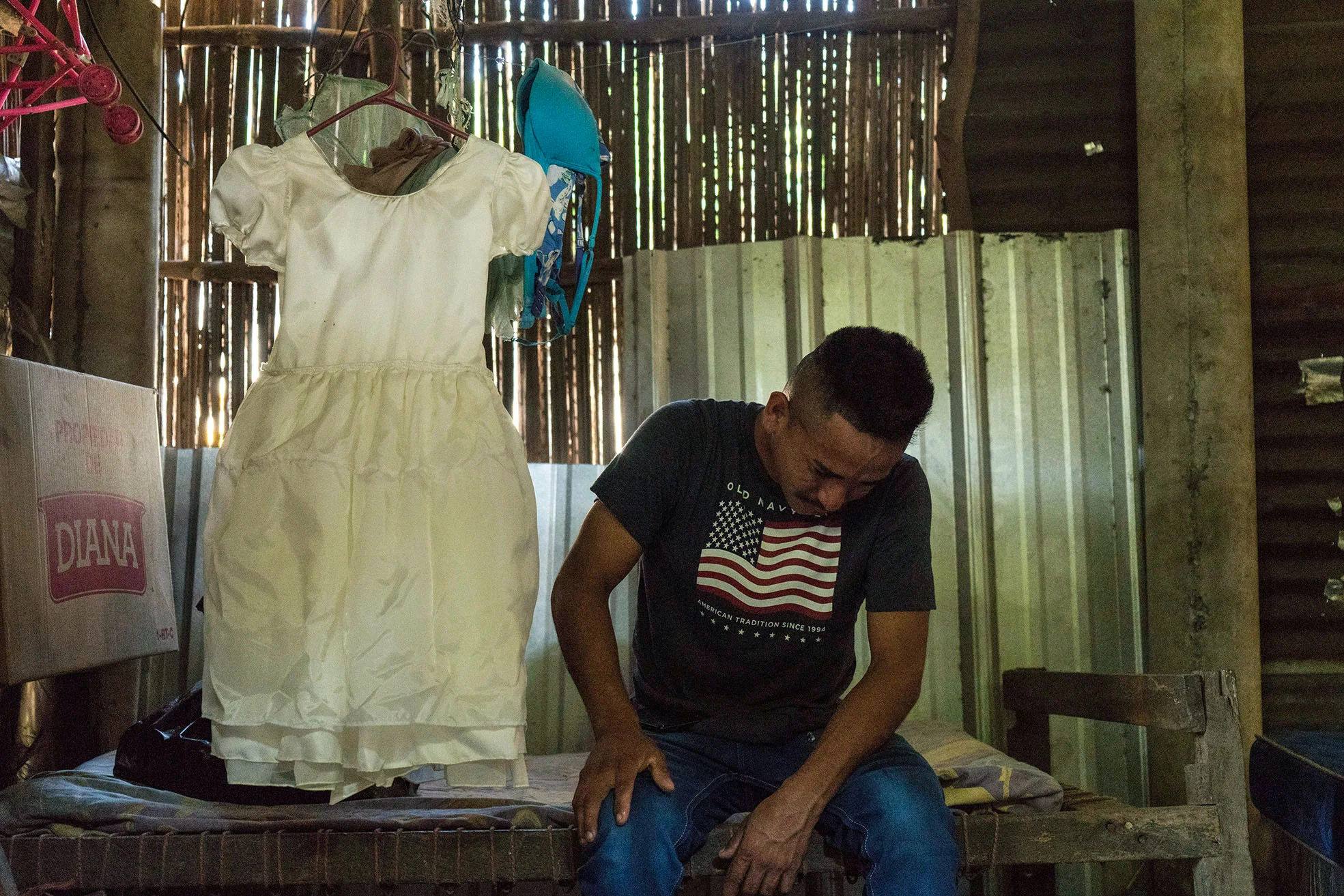 Arnovis Guidos Portillo breaks down after talking to his daughter on the phone at his house in Corral de Mulas, El Salvador, June 22, 2018