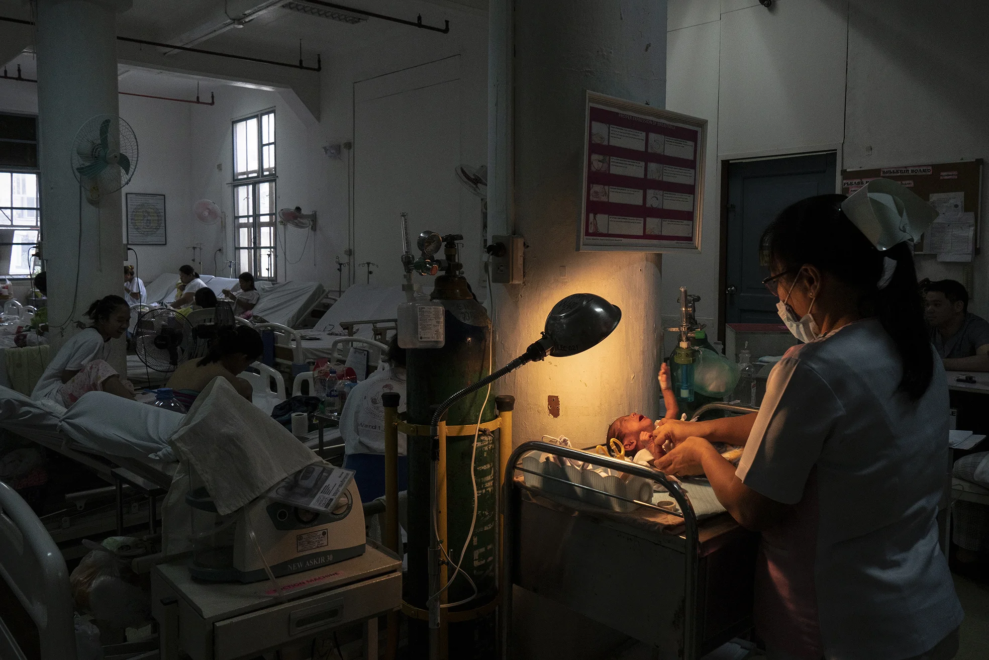 A nurse handles a baby in Fabella Hospital in Manila on October 21, 2018. Dr. Jose Fabella Memorial Hospital is considered the busiest maternity hospital with an average of 60 births a day from the poorest patients in Manila and nearby provinces.