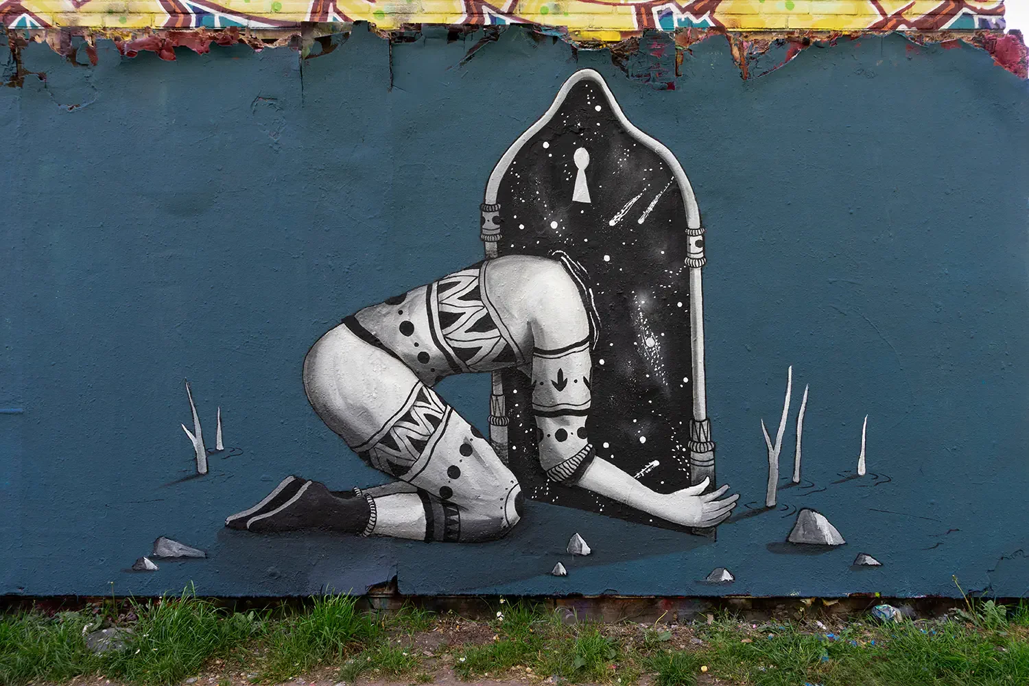 Beyond the Threshold mural in Amsterdam by street artist Skount featuring a figure entering a cosmic portal surrounded by surreal space imagery.