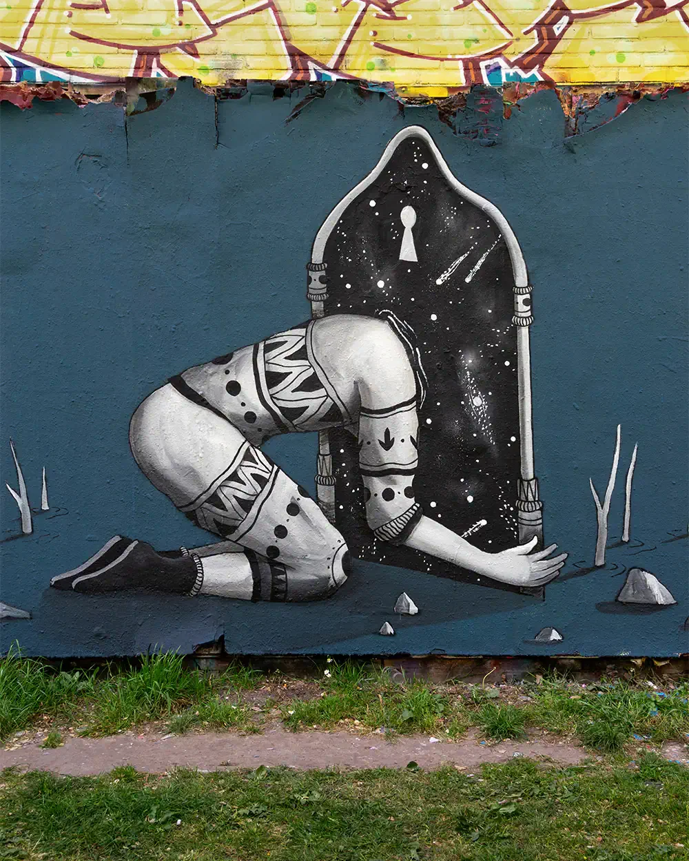 Detail of the Beyond the Threshold mural showing a surreal cosmic portal and symbolic street art elements by Skount.