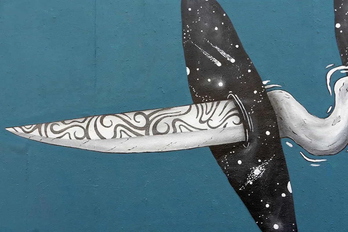 Close-up detail of The Sharp Threshold mural showing transformation and tension