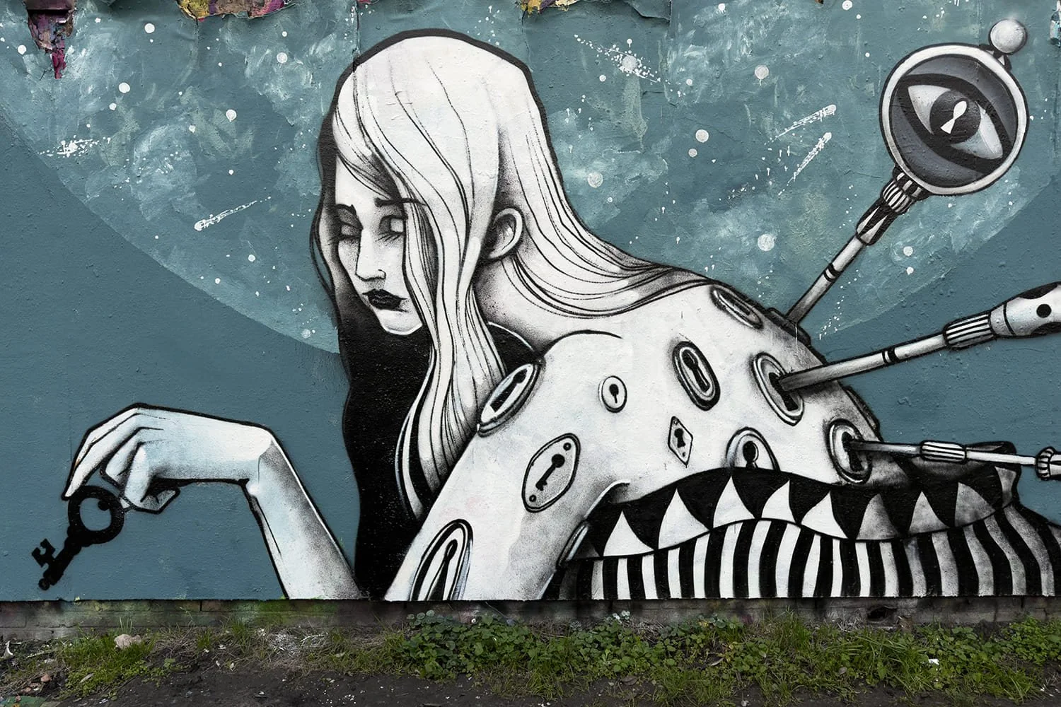 Detail of the woman in The Lady of Keys mural in Amsterdam, holding a key, painted by Skount and Malakkai