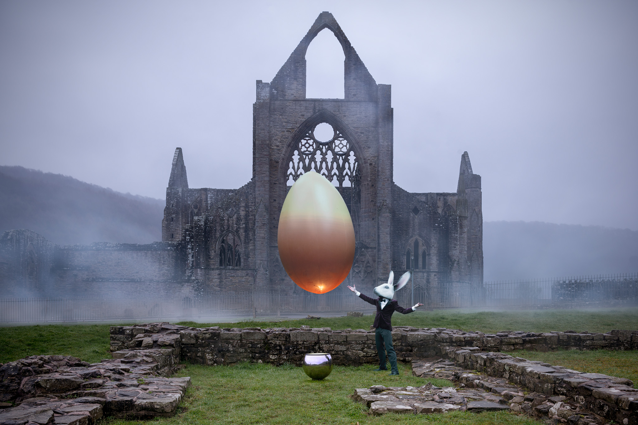  The floating egg was created by the ingenious folk at  Guineapig . It was filled with a mix of helium and air and floated over a jet of air from the chrome ball below. Photographed at Tintern Abbey 