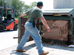 Our cardboard baler in action.