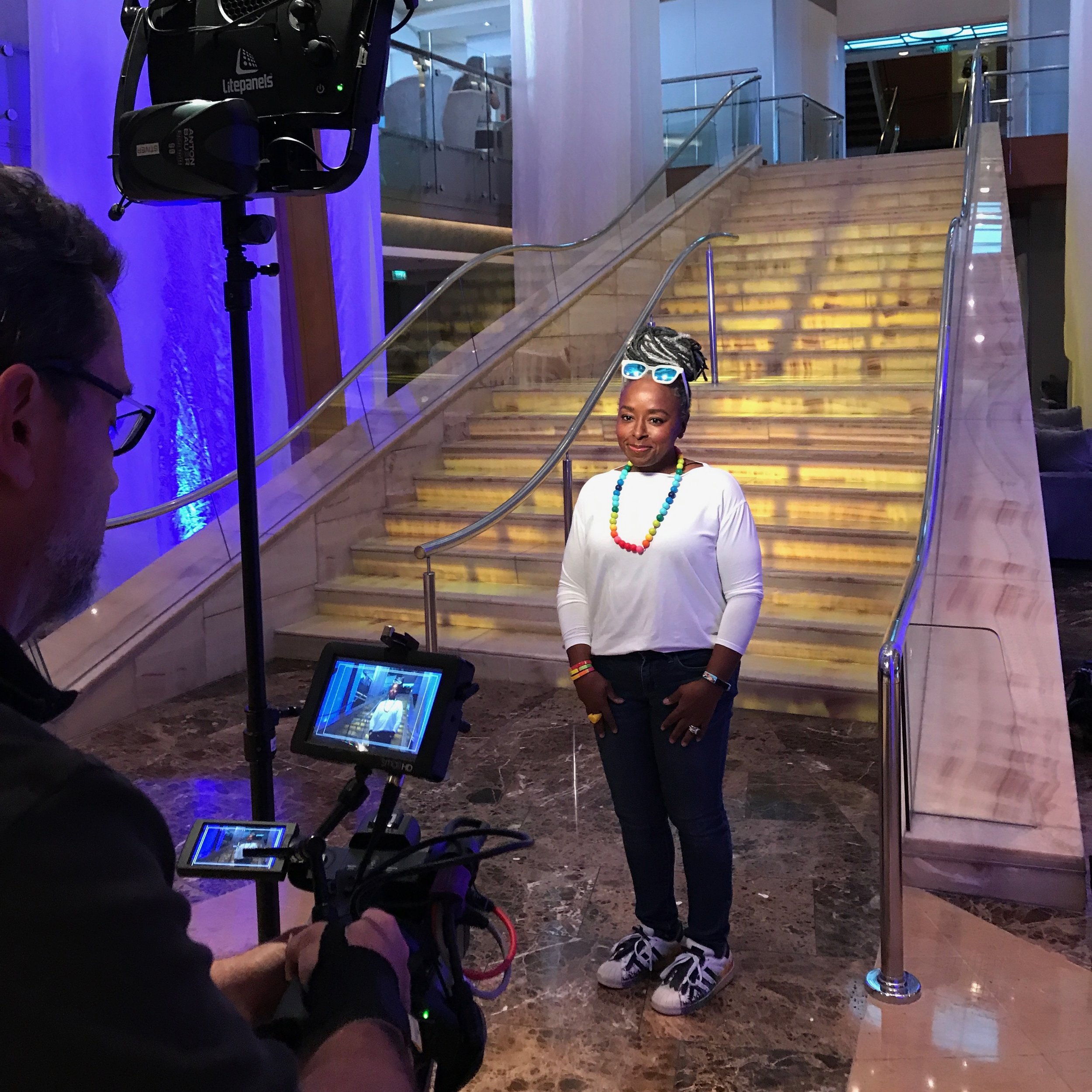 Caught on camera in the ship’s atrium, shooting my standups for the video.