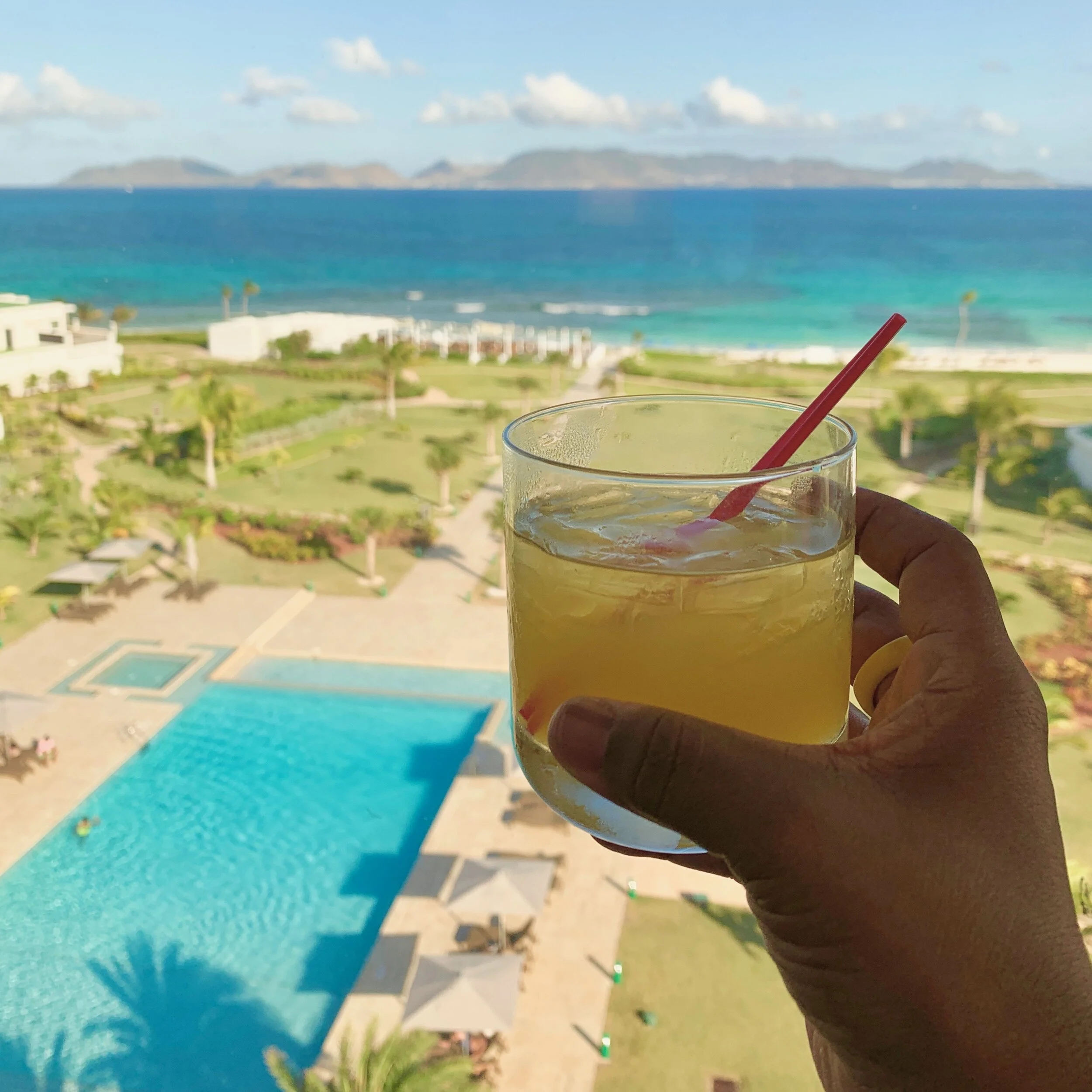 Enjoying the view of St. Maarten (just 12 miles away) from my suite at The Reef by Cuisinart