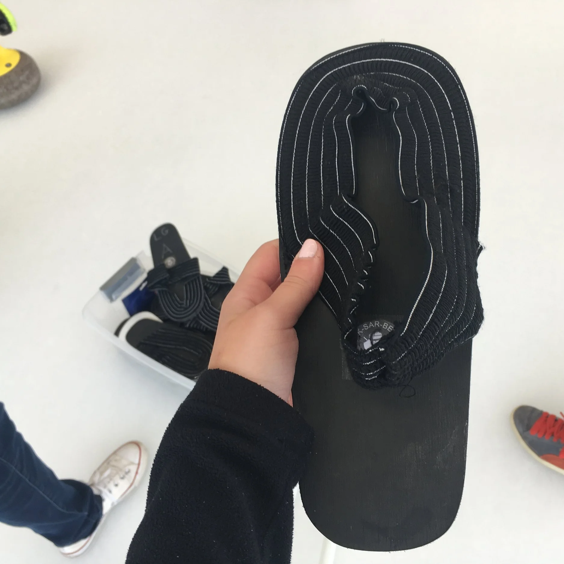 The slide-y shoe. I think real curlers have actual footwear, but we noobs worked with these. 