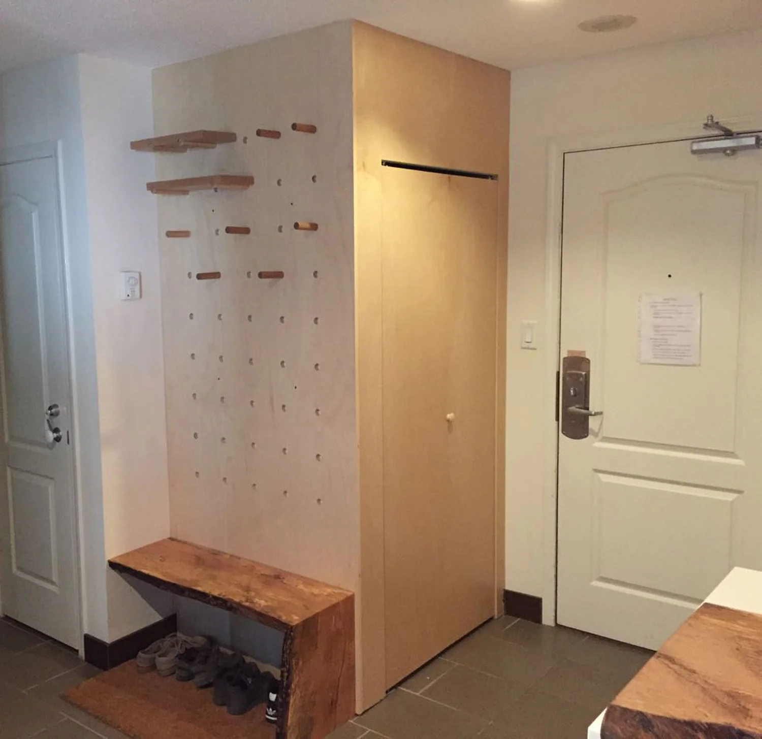 This area houses the washer dryer with a 1” pegboard wall and a spalted maple waterfall bench