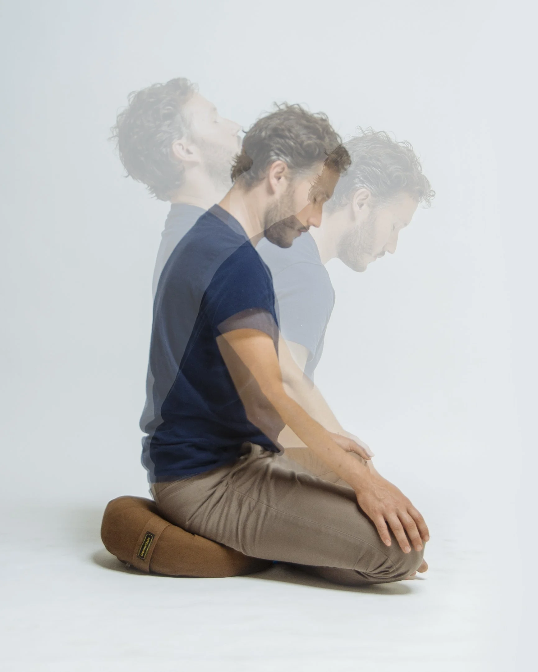 Steve Moses sitting on a meditation cushion in Oakland, CA.
