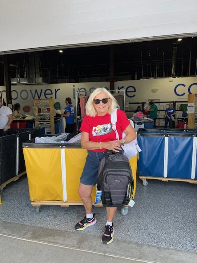 Marty dropping off our collected school supplies at APC