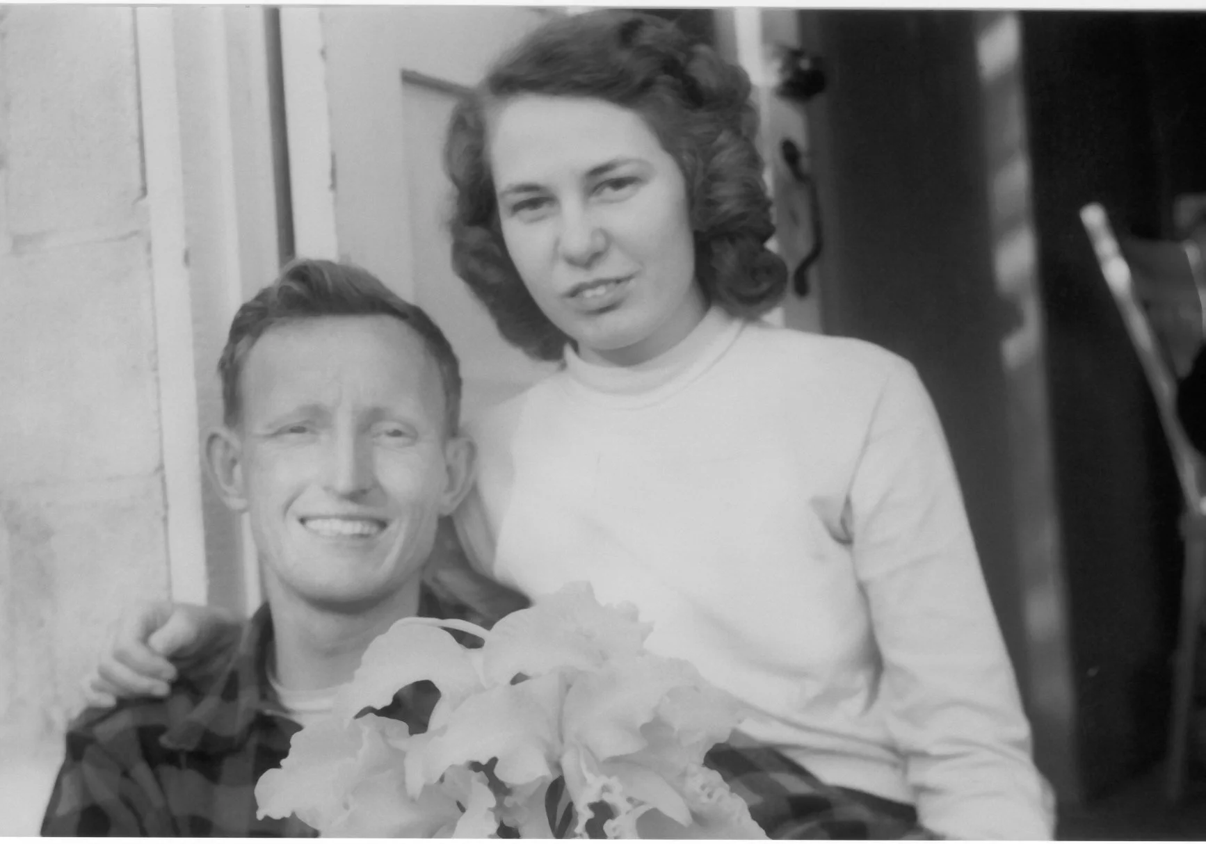 Bob and Arlene in greenhouse Edina 1949.jpg