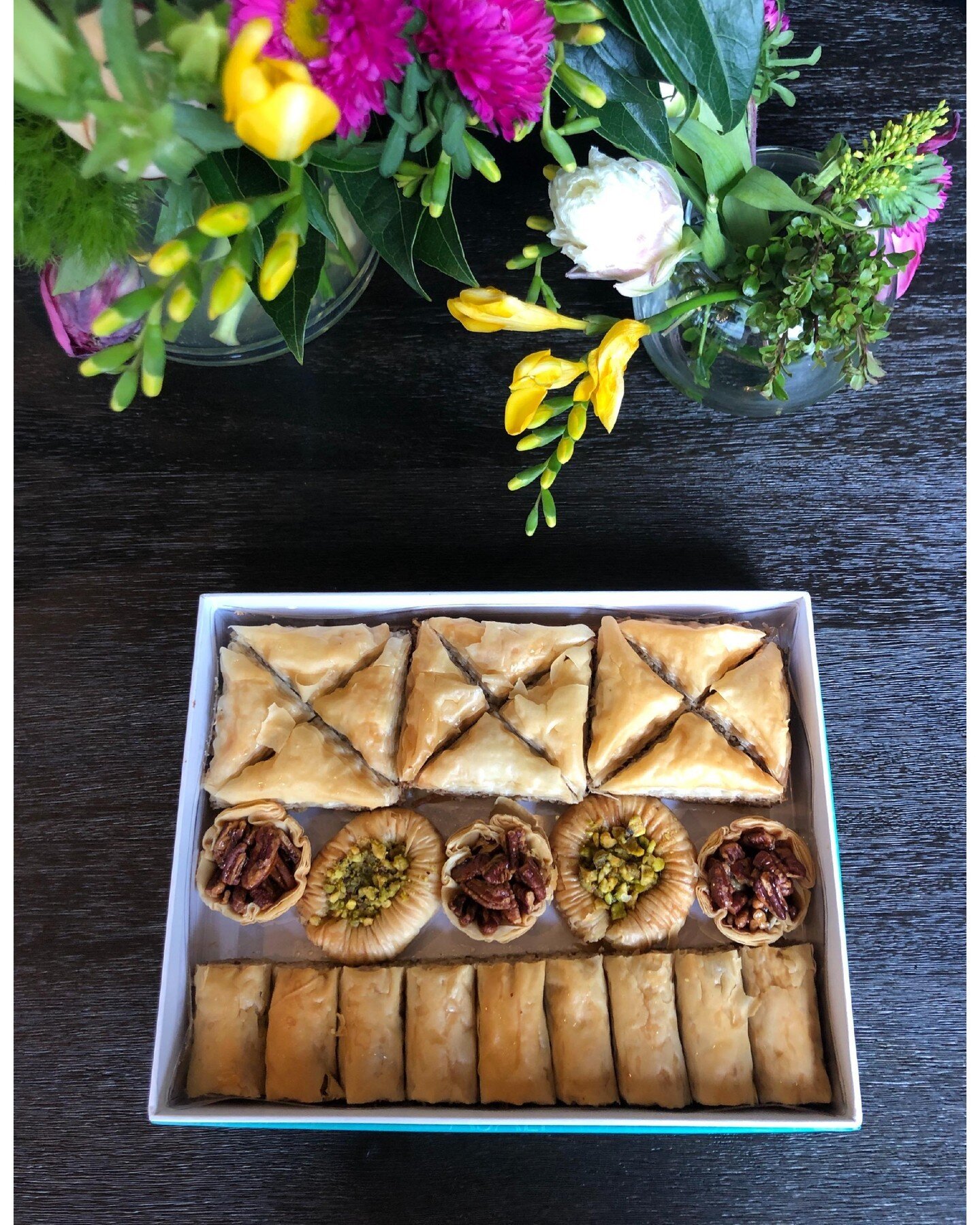 In charge of bringing the dessert for your holiday weekend celebrations? We've got your covered with our crowd pleasing Baklava Variety Box!

They're available for purchase at the cafe and on our website in sizes Small and Large.

To confirm current 