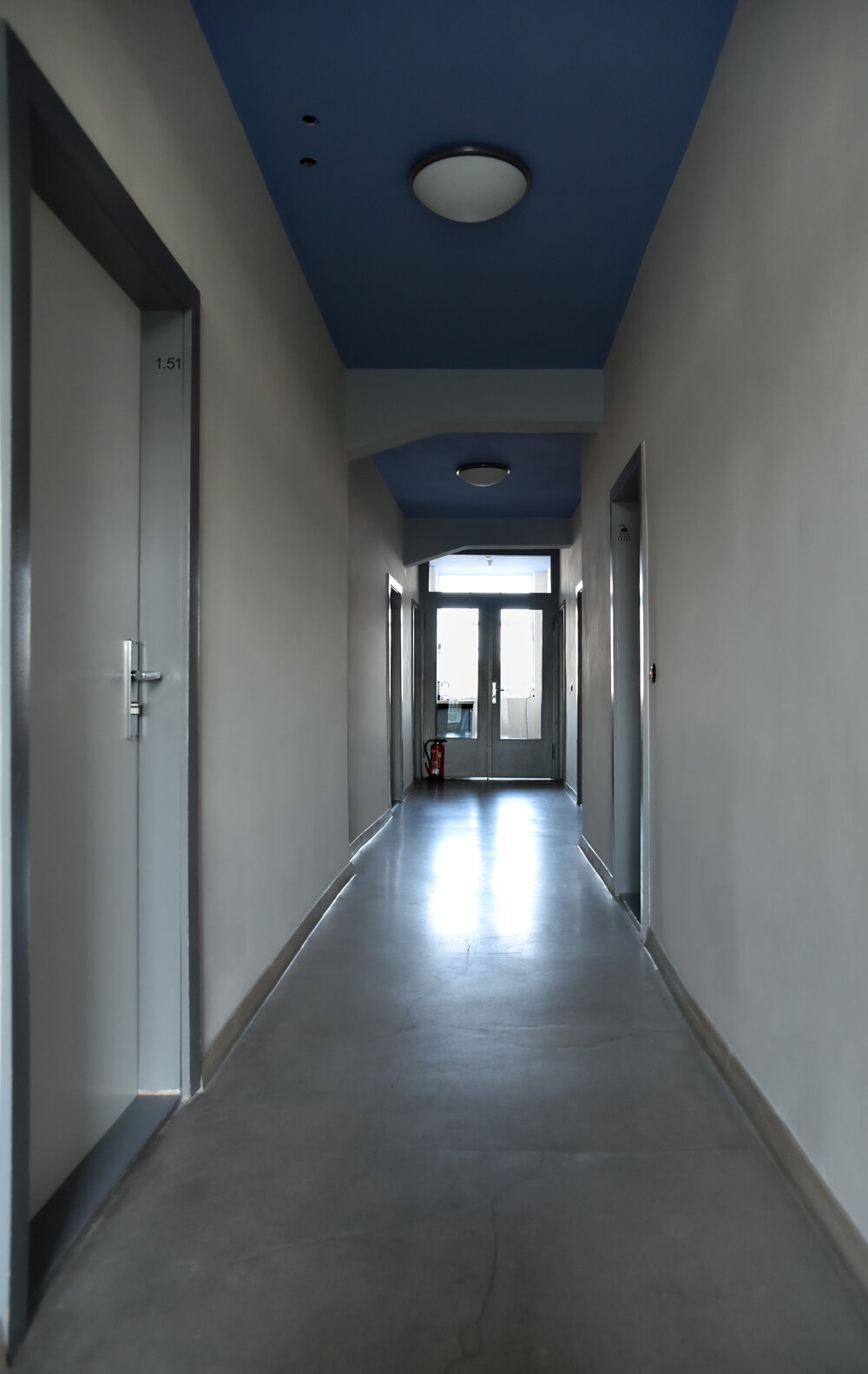 Bauhaus Dessau studio residence corridor towards shared kitchenette.