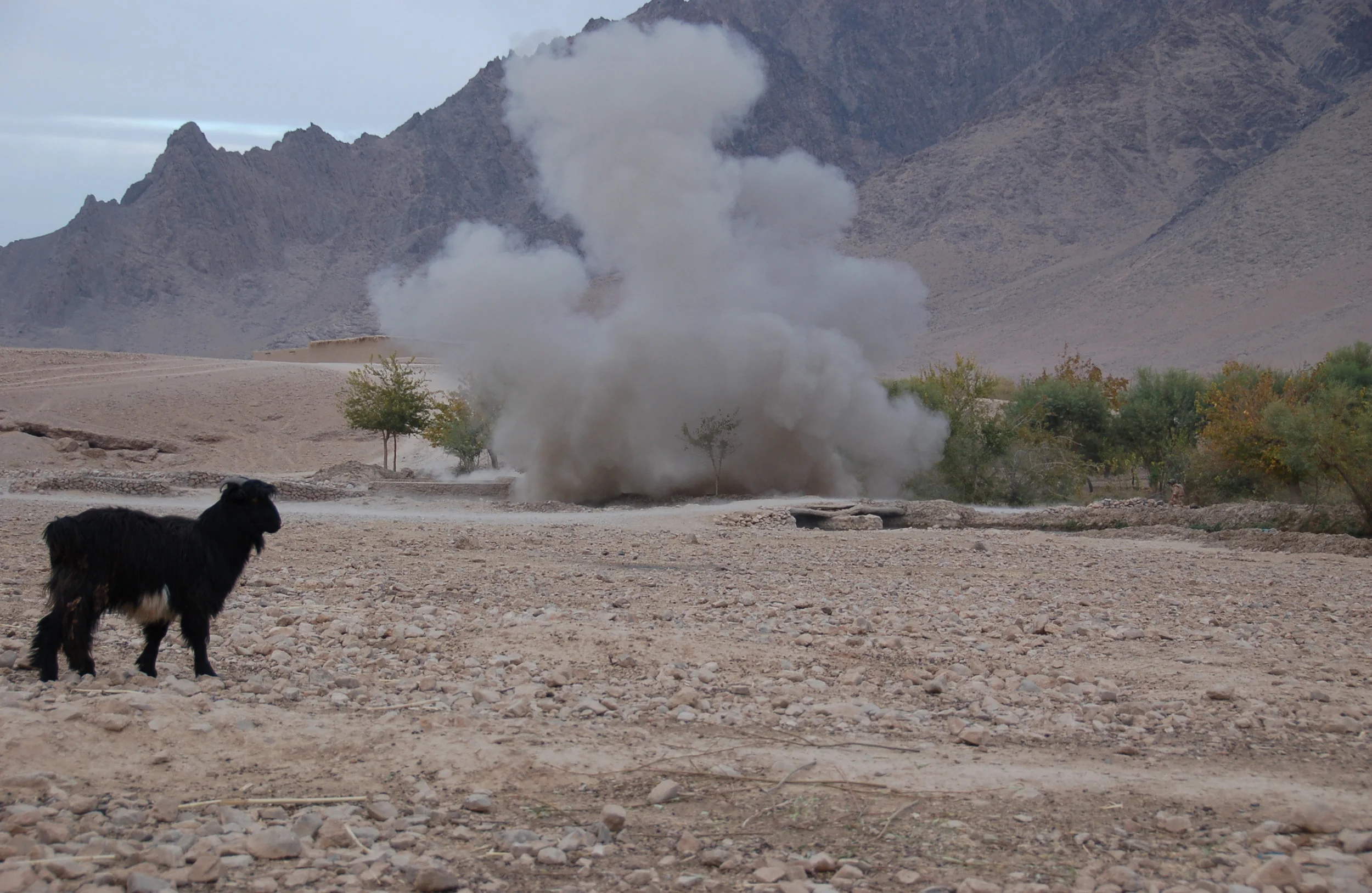 An abandoned Taliban fighting position is destroyed in a controlled explosion during a sweep of the Balochi Valley, Uruzgan province, by British, Dutch and Afghan forces. November 2007.