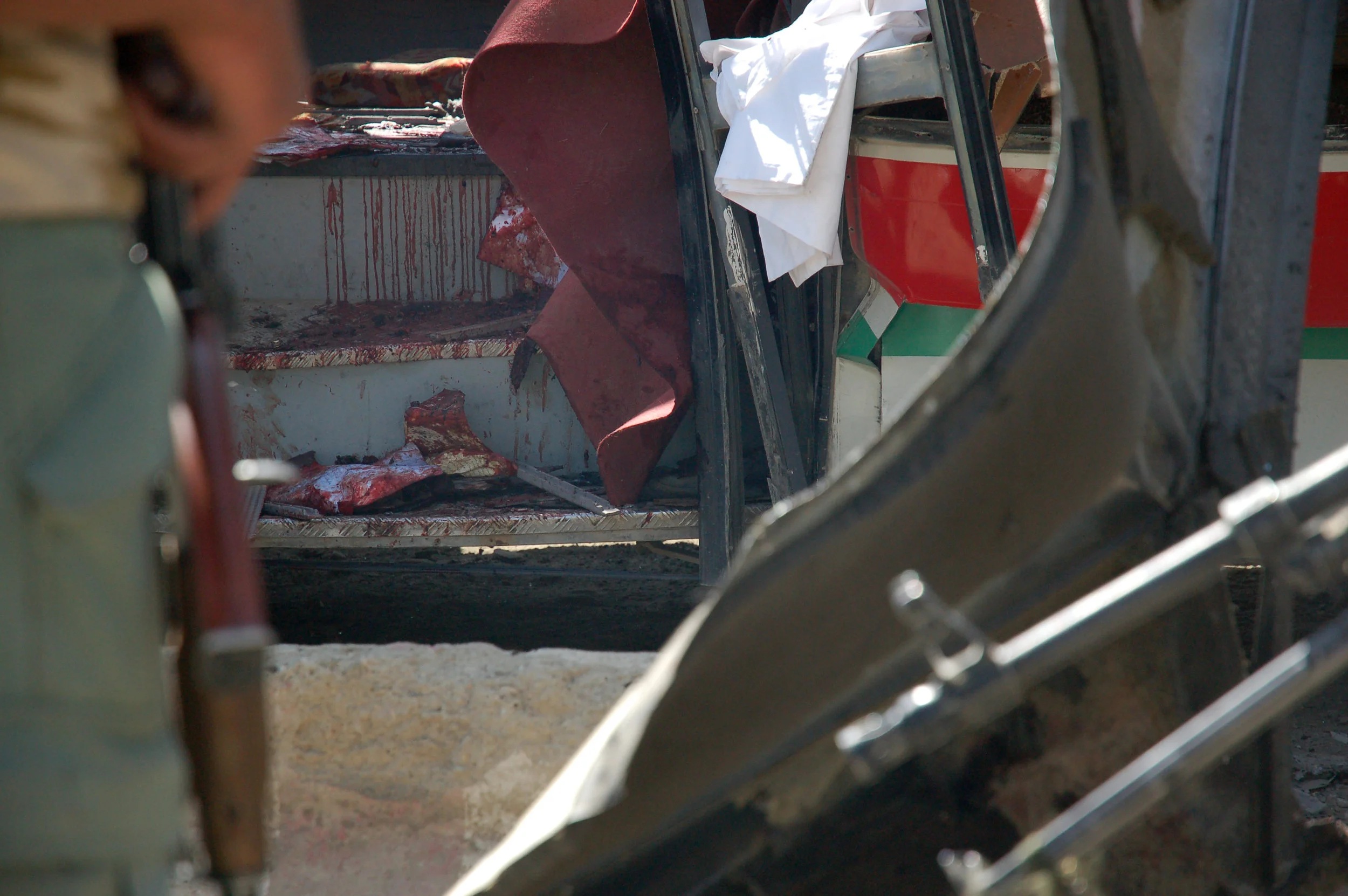 The scene soon after a suicide bomber struck a bus carrying police recruits in central Kabul. At least 35 people were killed and 52 wounded. June 18, 2007.
