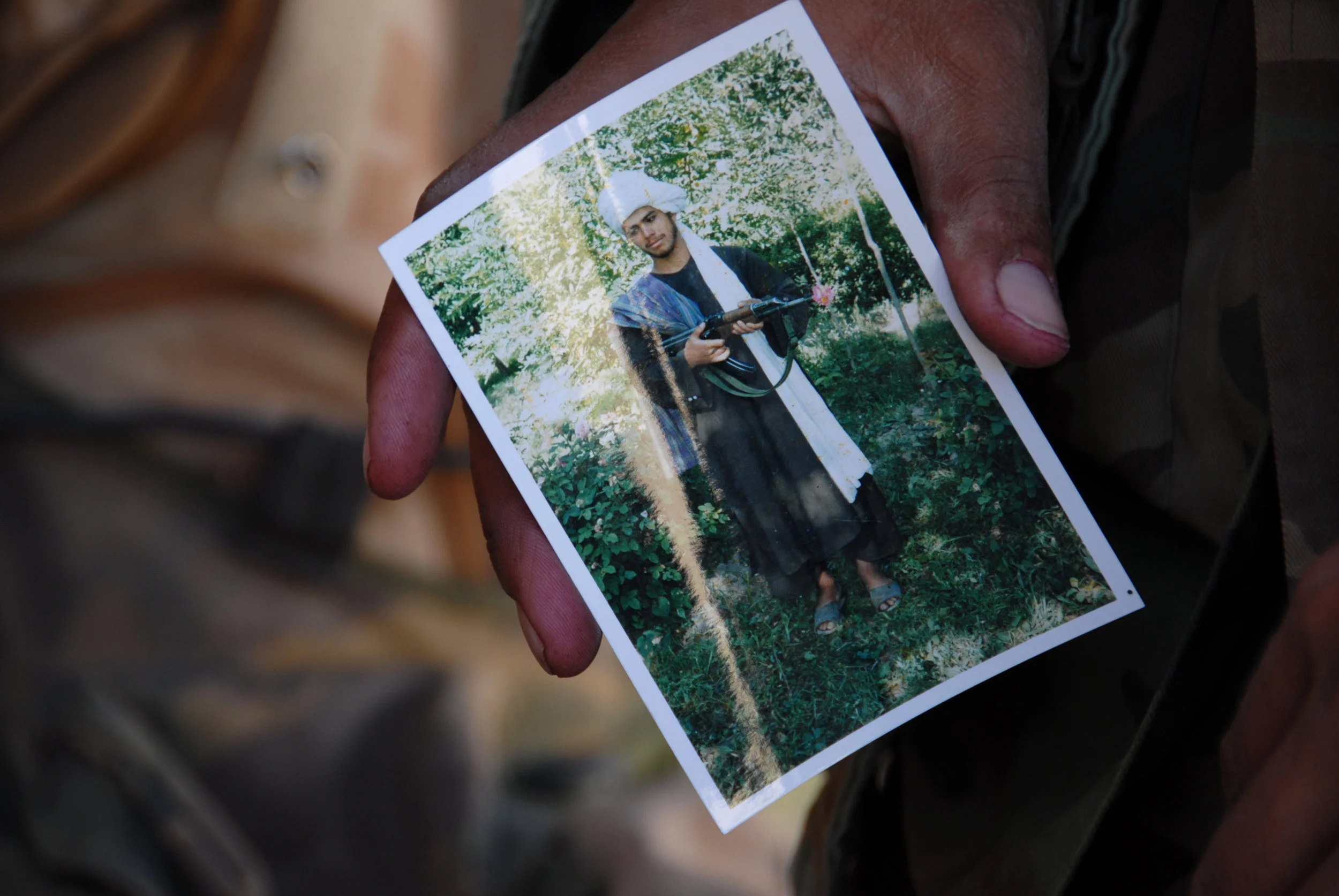 A photograph of a Taliban suspect found during a house raid by British, Dutch and Afghan troops in the Balochi Valley, Uruzgan province. November 2007.