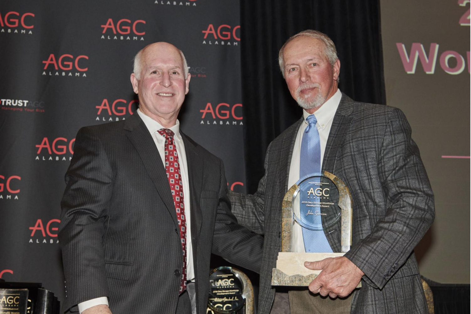 John Garrison (Garrison Steel) of Pell City (right) receives the Alabama Associated General Contractor's Gary Savage Workforce Development Award at their annual banquet last week. Gary Savage (left) presents the award to John Garrison. Photo submitted  Edward Badham