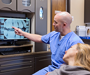 Dr. Heath showing a patient a digital x-ray. Photos by Andrea Smyth Photography
