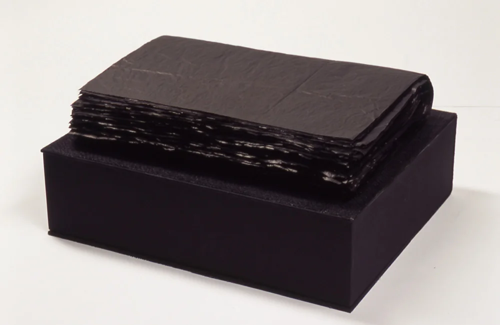 Found Gucci | 2003 | Box: 15" L by 12" W by 4" H Book: 14" L by 10" W by 3" H | Tissue paper, burlap, book board, fabric, and wax string