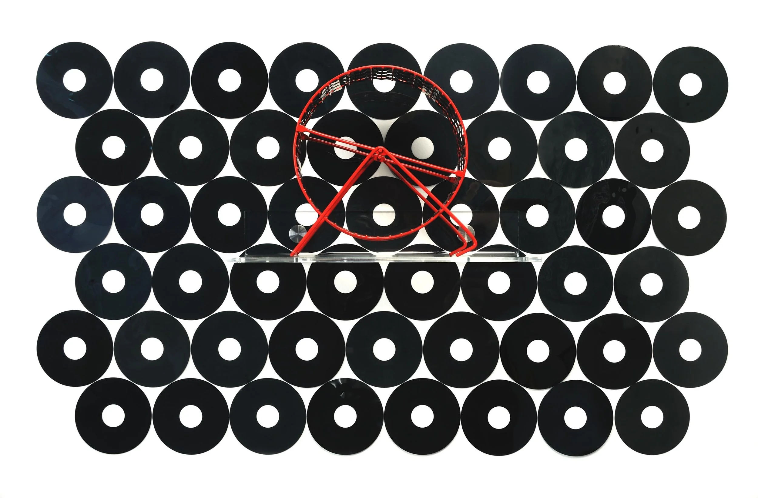 Red Circle Thoughts | 2016 | Dimensions varied | Floppy disks, red hamster wheel, and plexiglass shelf