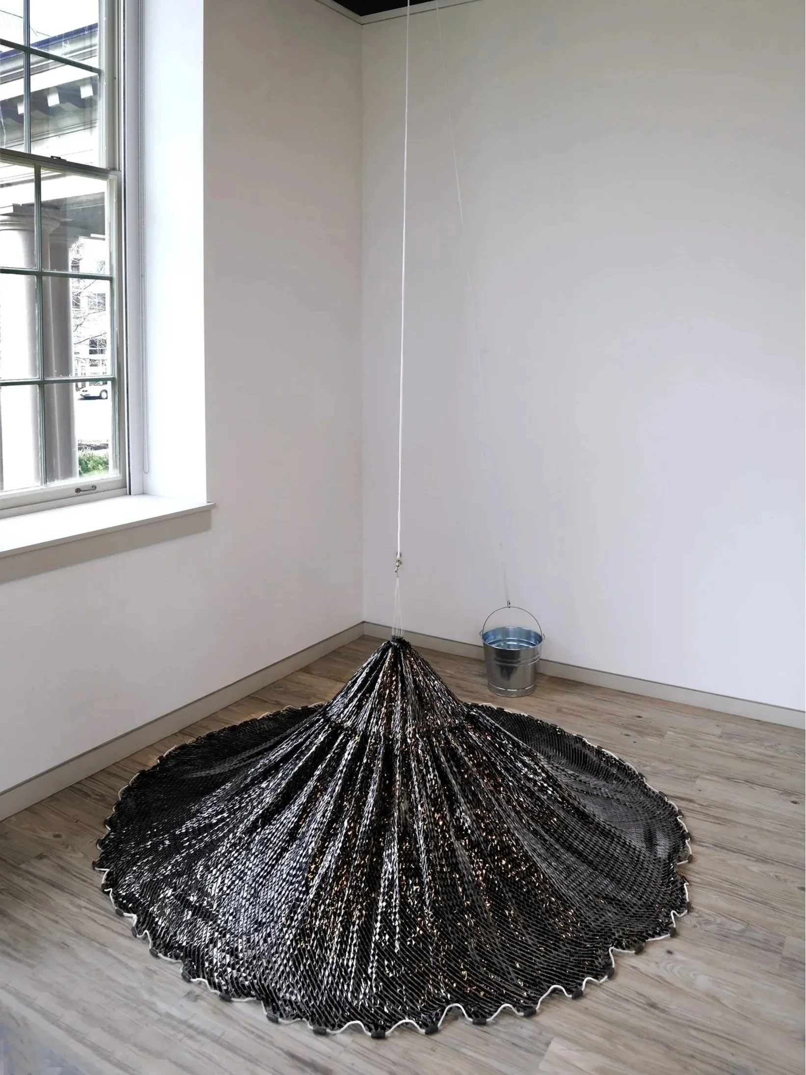 Saturated Fish Net | 2014 / 2017 | Nylon fish net, VHS video tape, adhesive tape, galvanized tub, and water