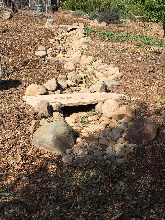Cobble swale with bridge stone