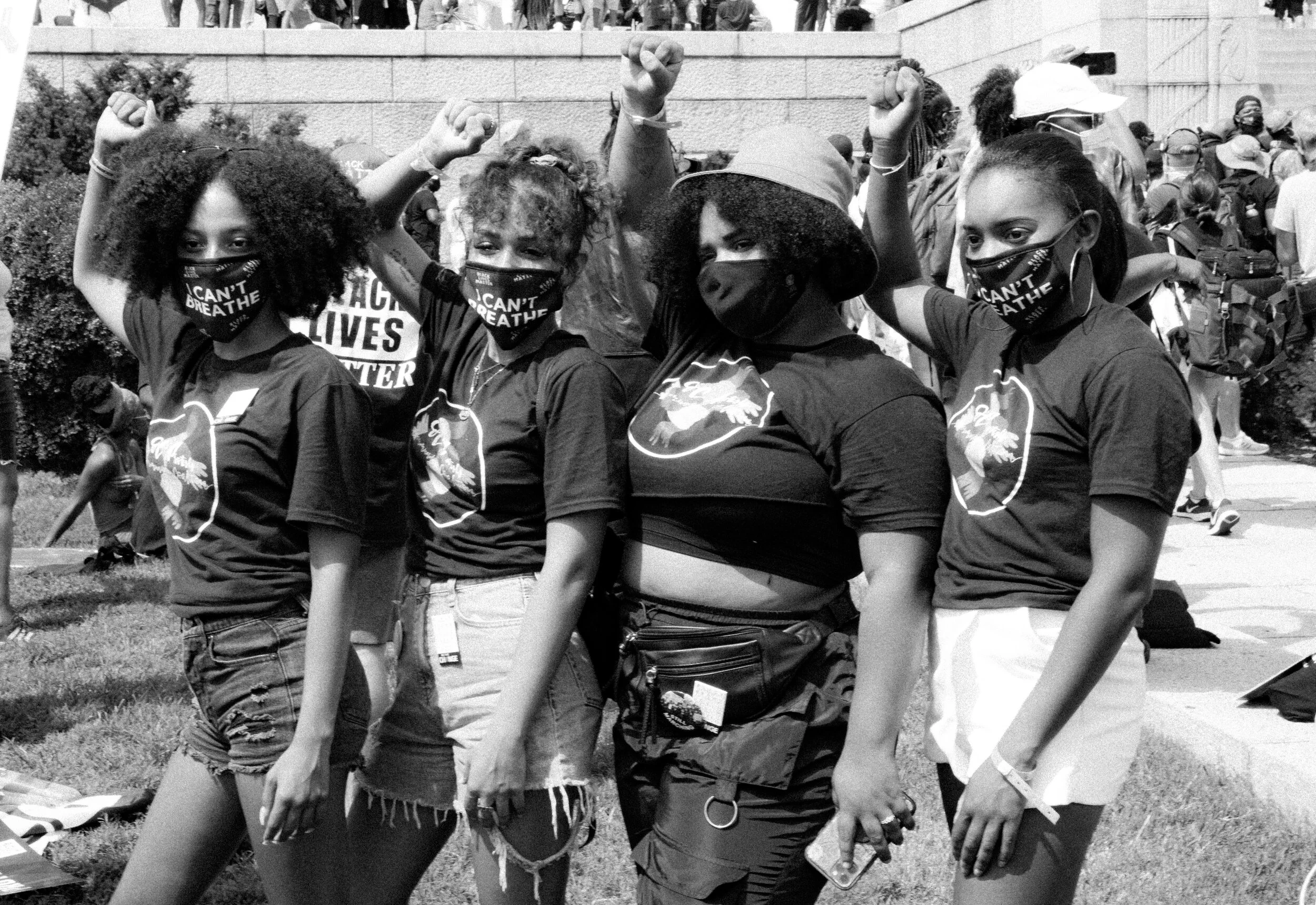 4WomenPoseWithFistsRaised.jpg