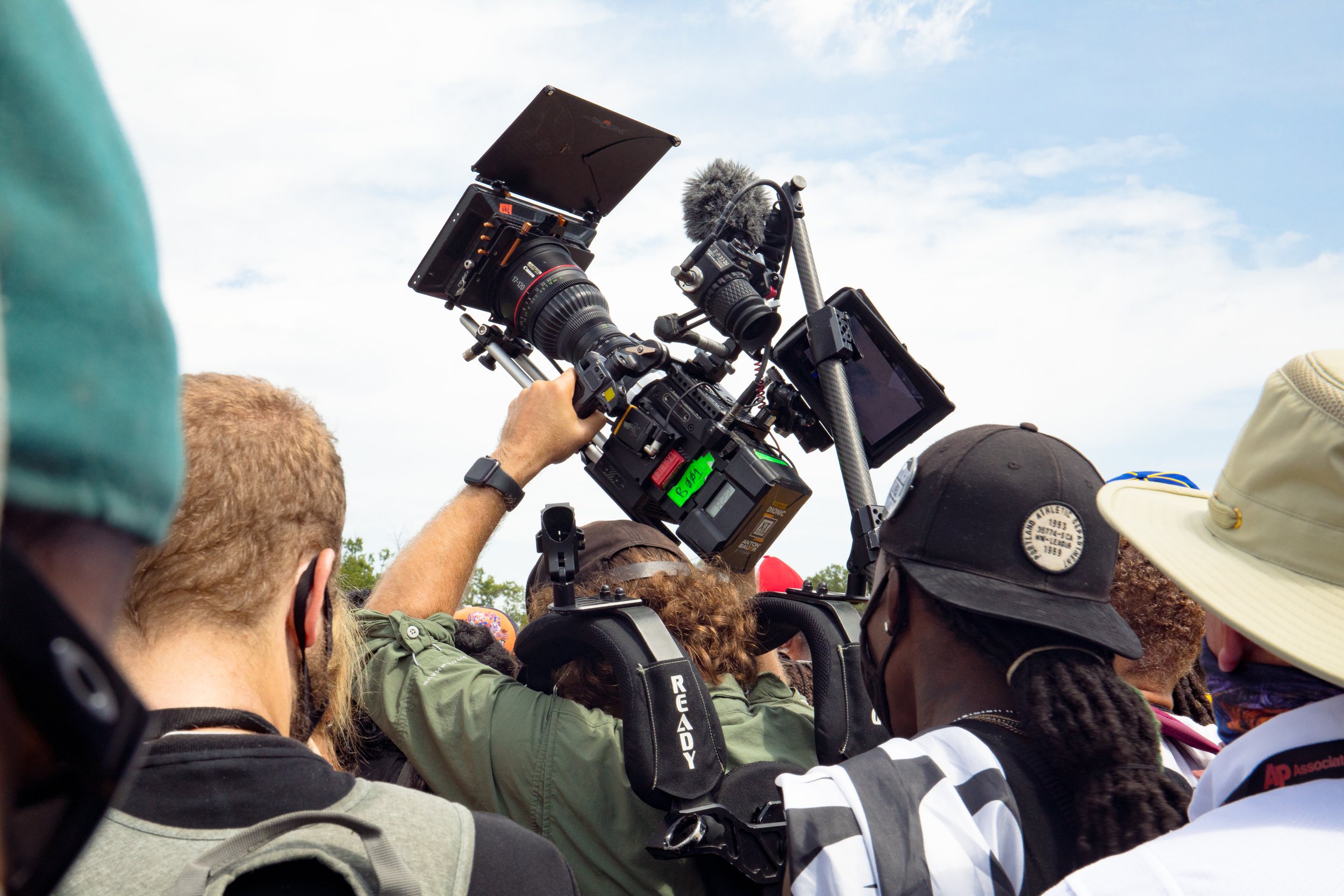 cameraManInCrowd.jpg