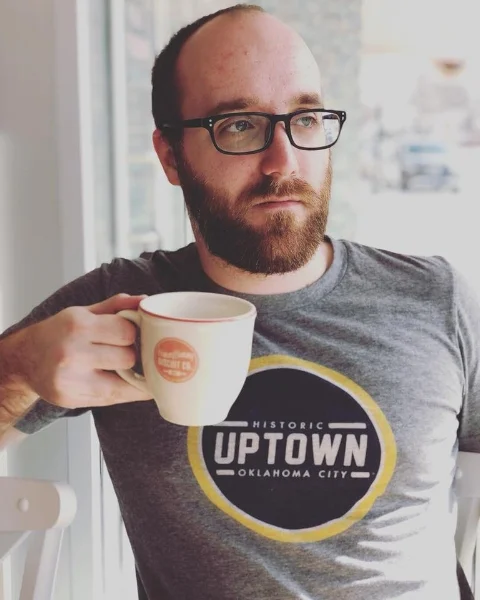 Chris drinking an empty mug at HunnyBunny
