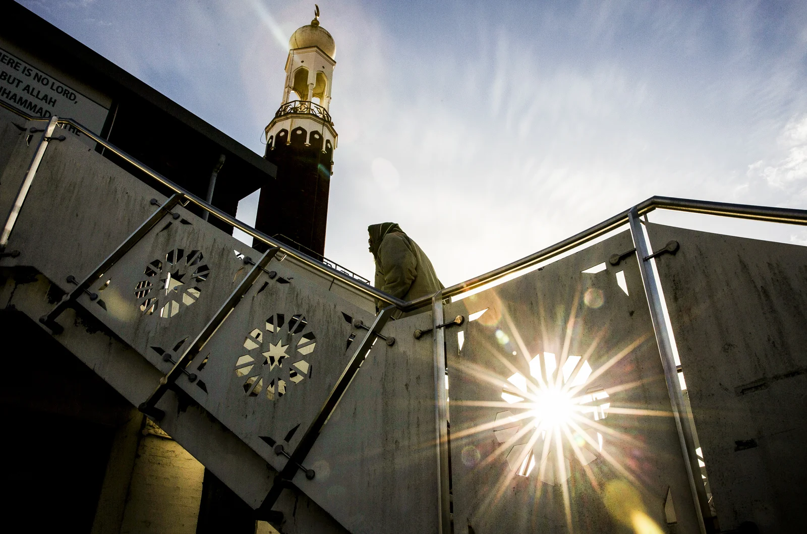  A man arrives at the Birmingham Central Mosque in Birmingham for Midday prayers.