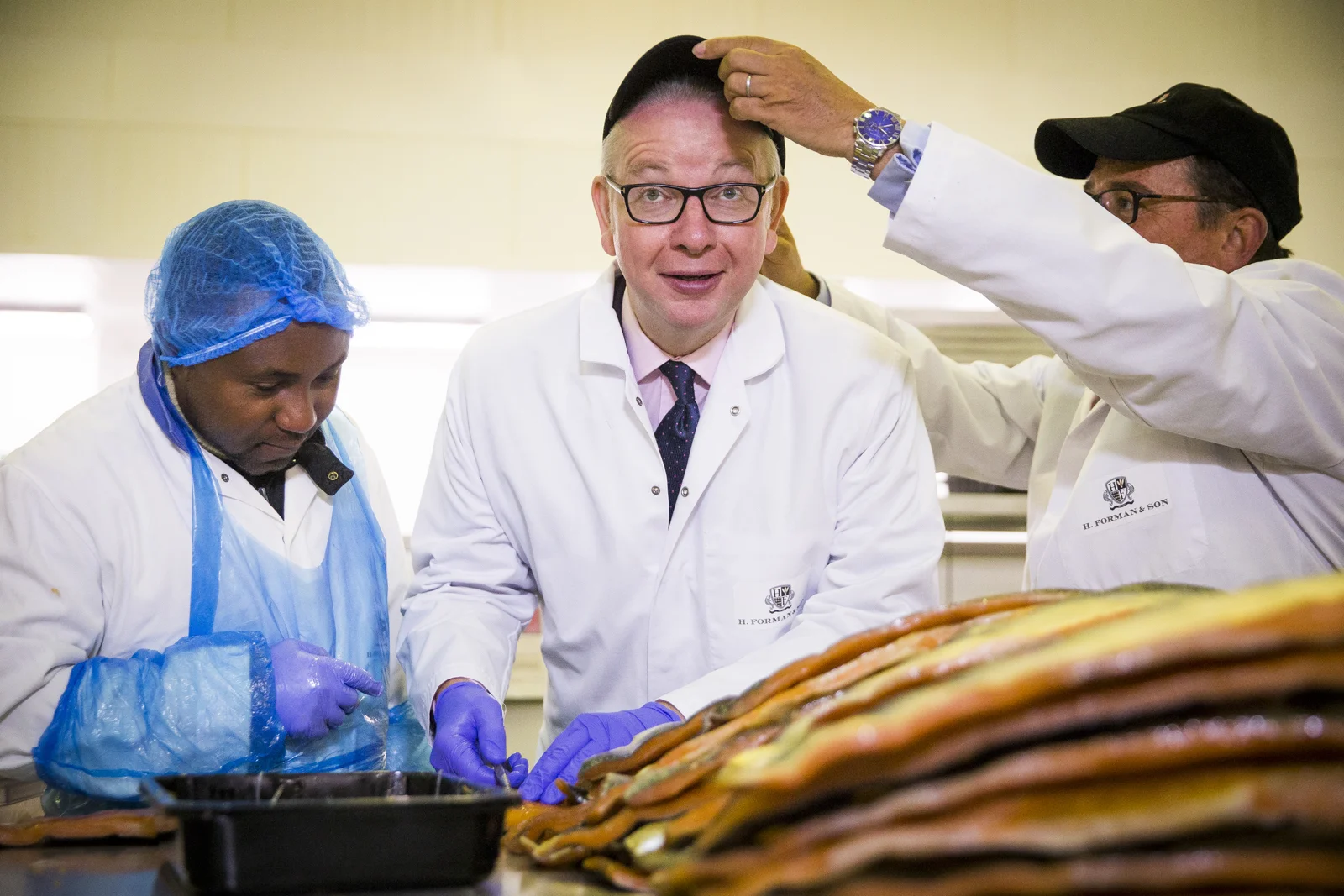 Secretary of State Michael Gove visits H. Forman & Sons smoke salmon factory in Hackney Wick, London.