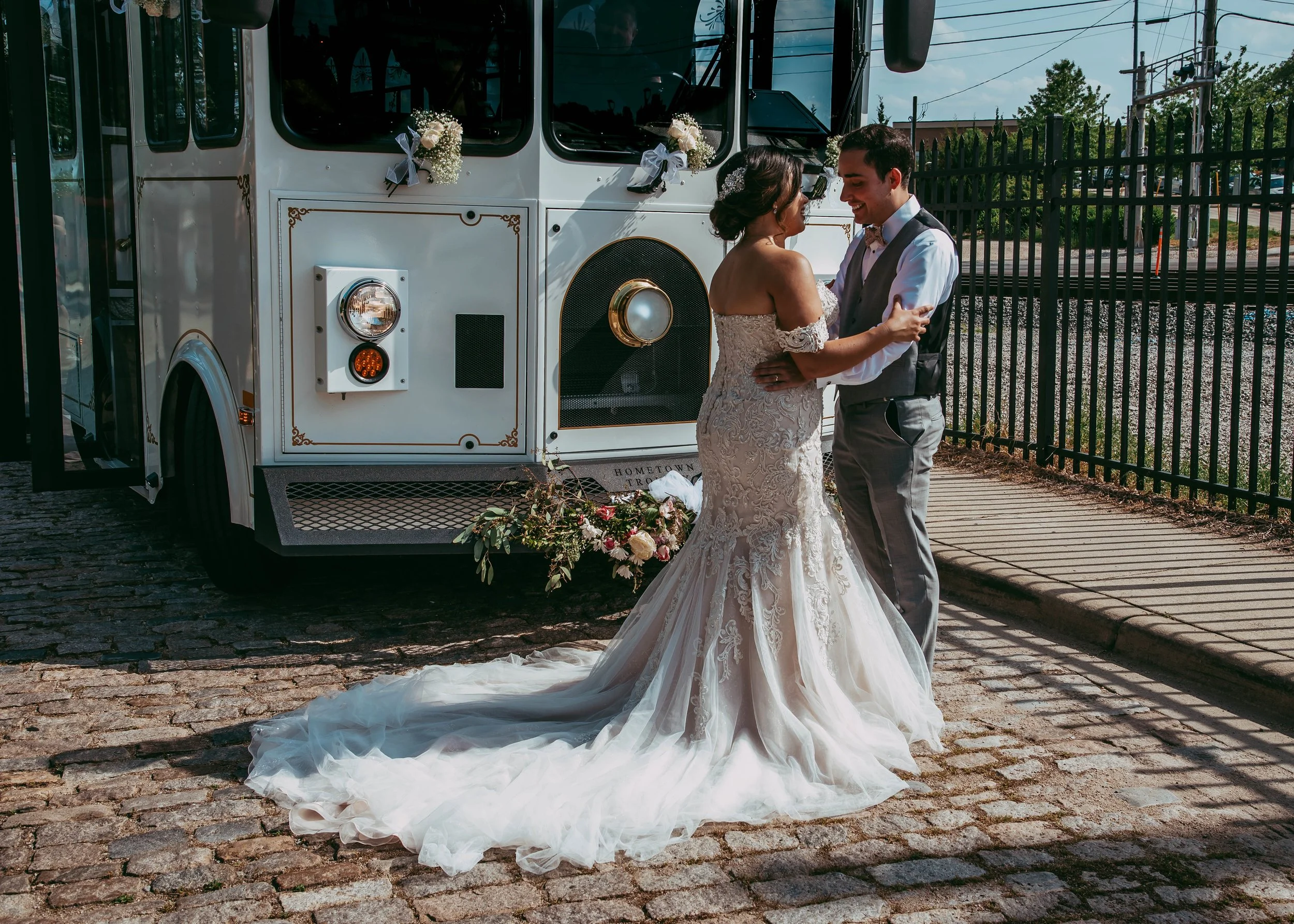 Bride & groom in front of the Great Raleigh Trolley