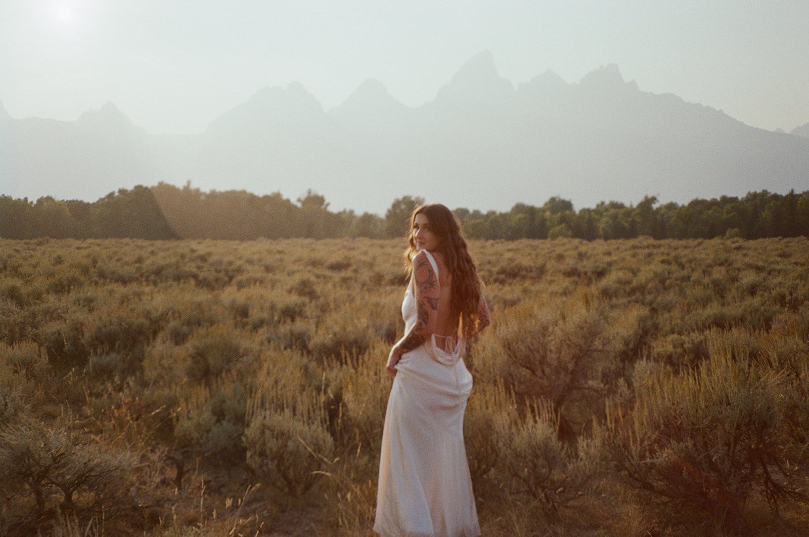 bride in front of the grand tetons in jackson hole wyoming shot by sadie lynn films