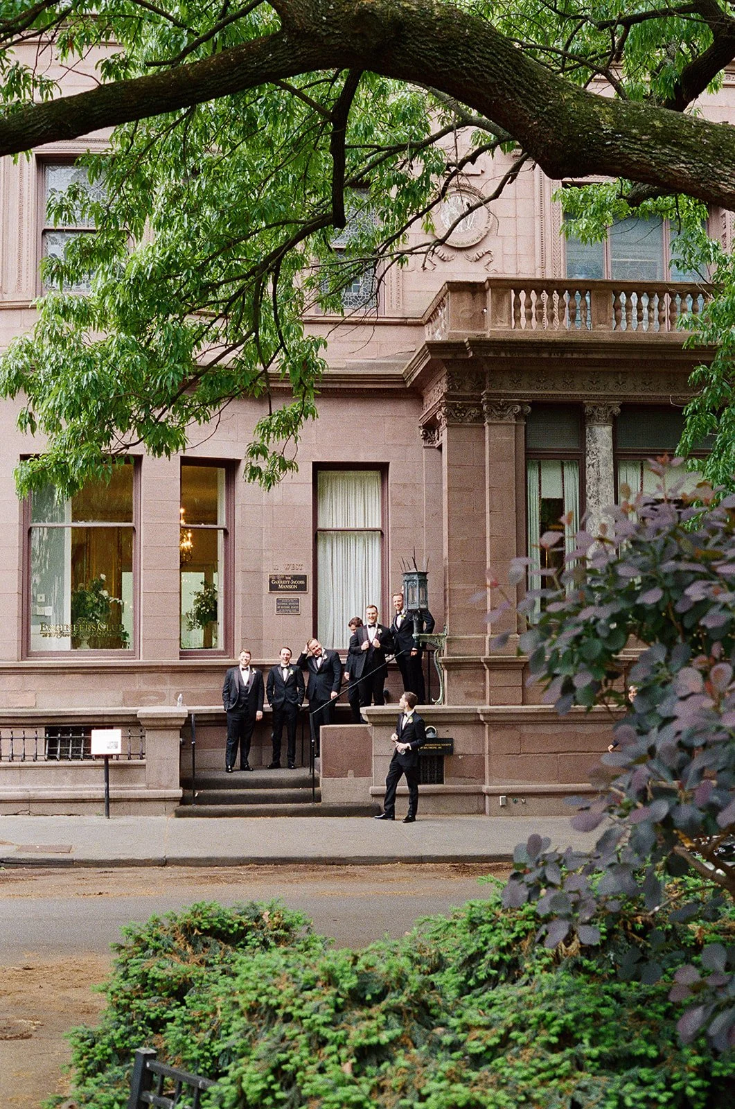 groomsmen waiting outside of the baltimore engineers club for a wedding