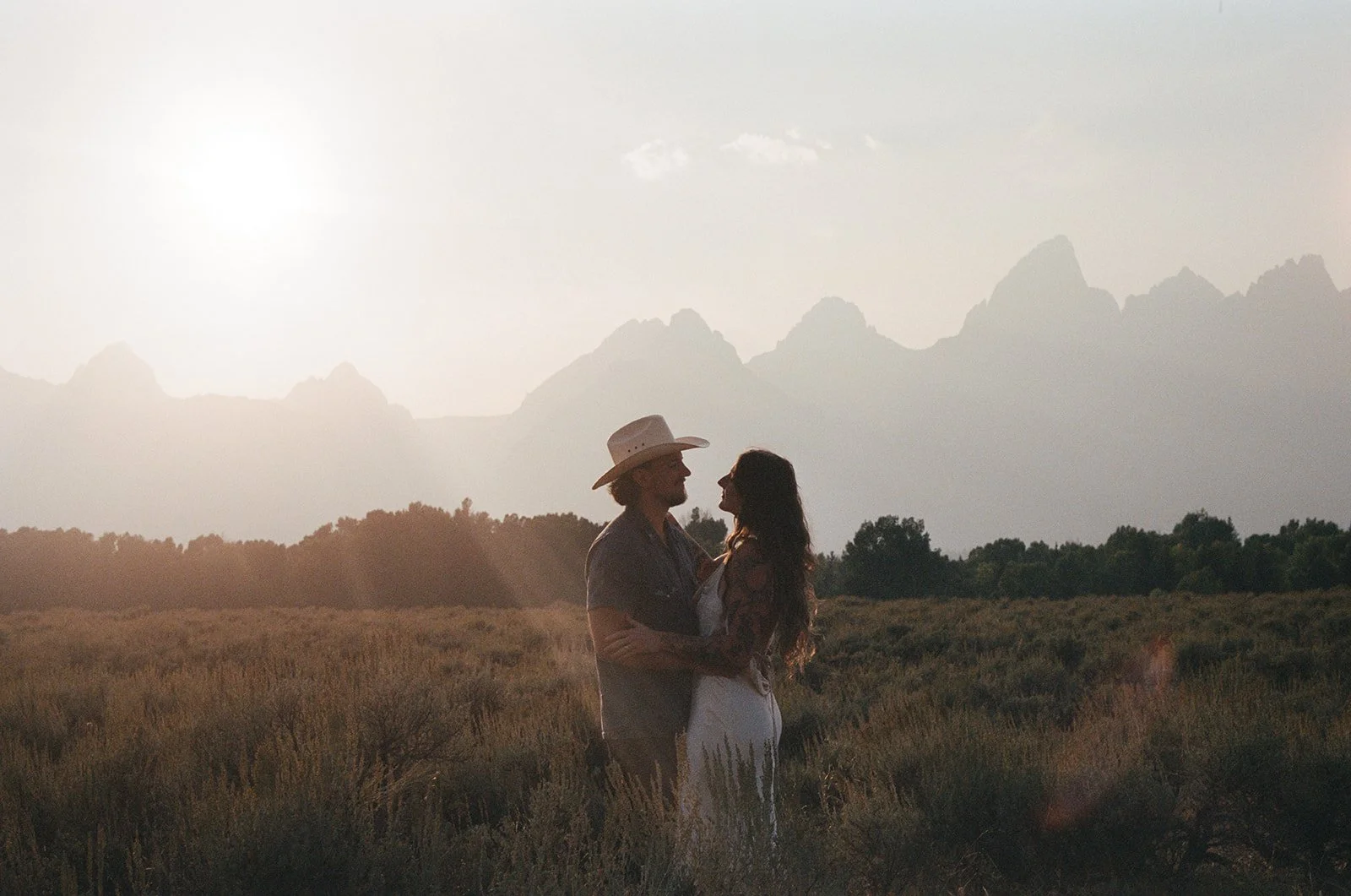 bride and groom in front of the grand tetons on film photo