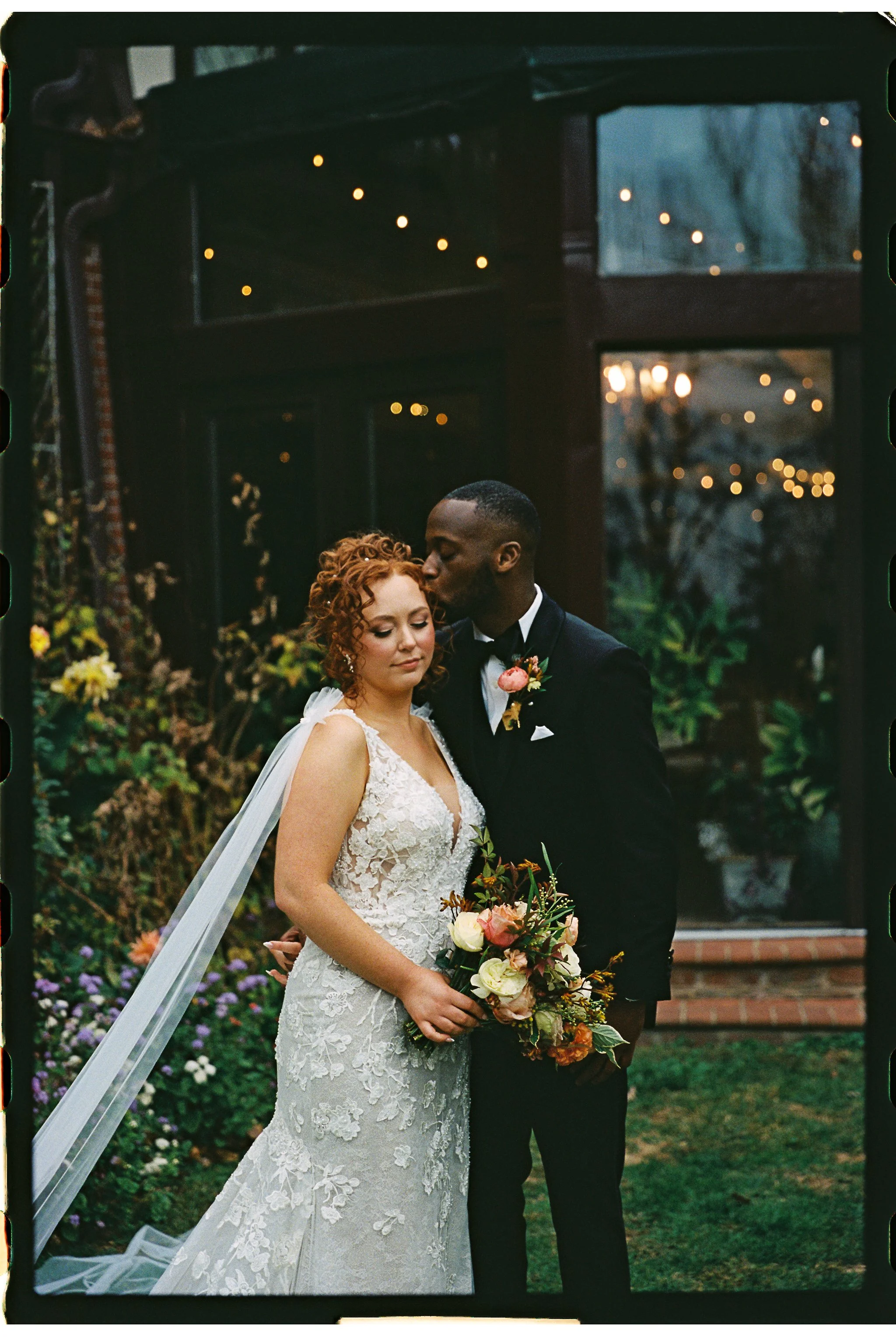 Bride and groom embracing in garden wedding setting gramercy mansion maryland wedding 35mm film