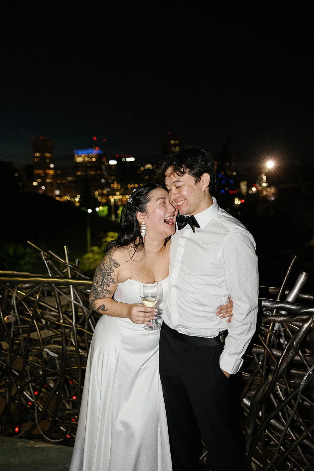 bride and groom standing on the balcony of the american visionary museum
