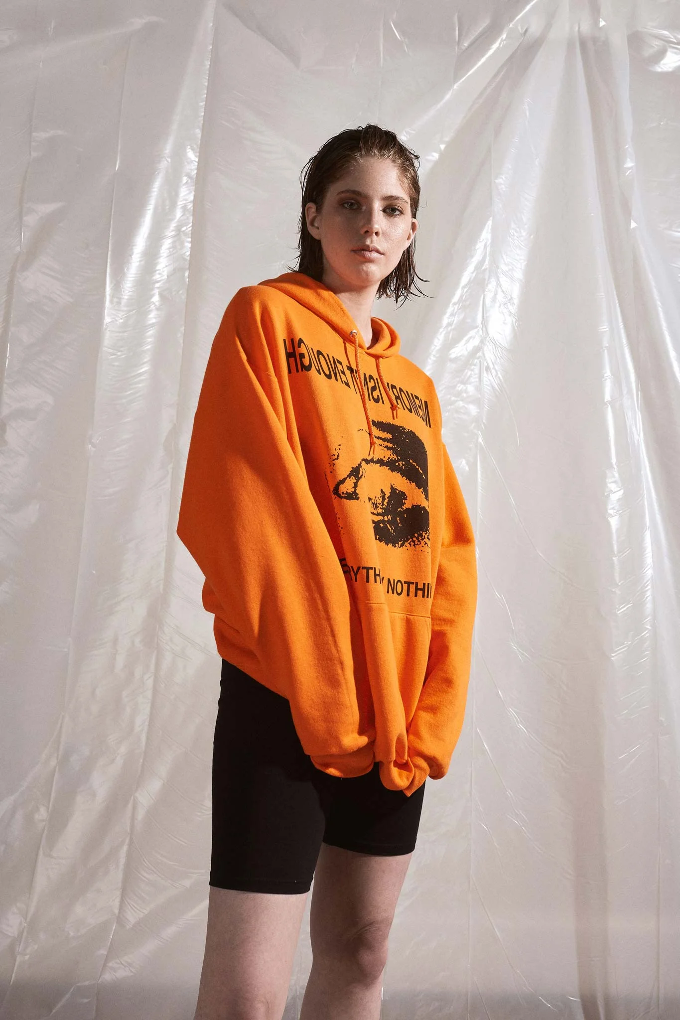 Model is wearing the Memory Isn’t Enough Oversized Safety Orange Hoodie