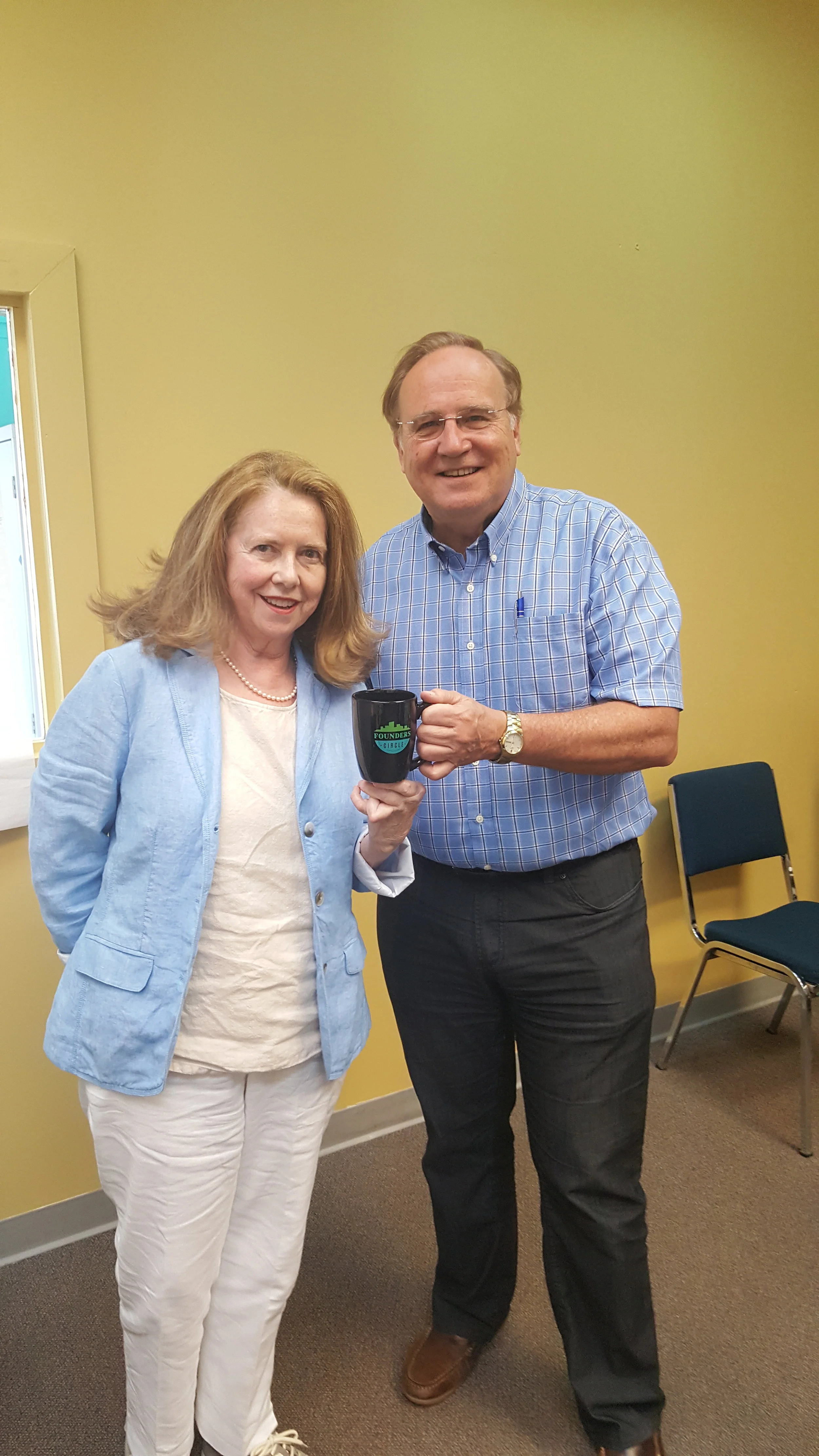 Stuart Morley presenting the mug to Maureen Cibberley who is the PMCN rep on Founders Circle