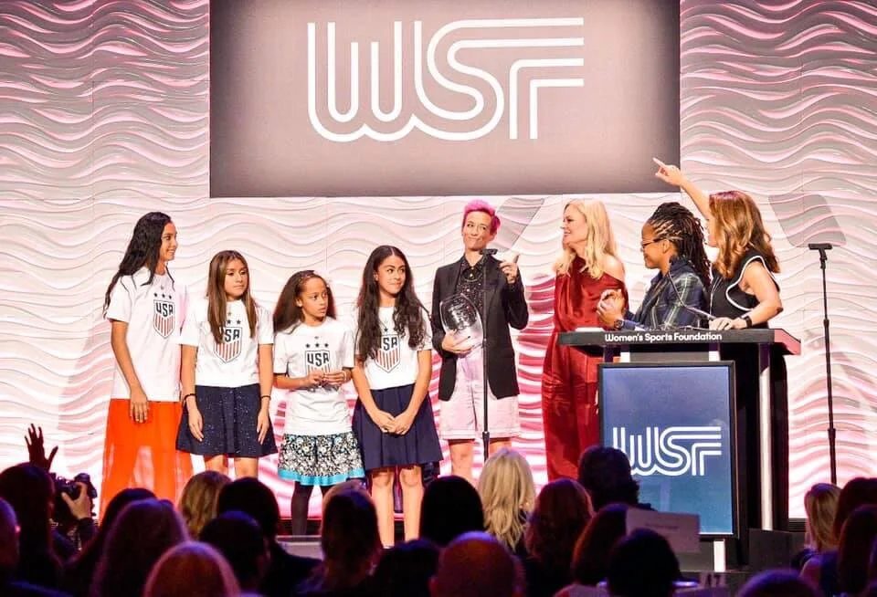 US Women’s National Team honored at Womens Sport Foundation annual awards. SCORES students join Megan Rapinoe.