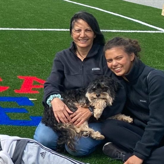 Amazing parent volunteer, Gina Cockburn, with dog and daughter, enjoying the new field
