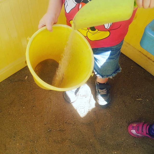 Check out this toddler! While transfering sand from the ground, to a shovel, and into a bucket; he's learning major math/science skills. The way the sand moves and pours teaches him things about the way gravity and the laws of physics works. The chan