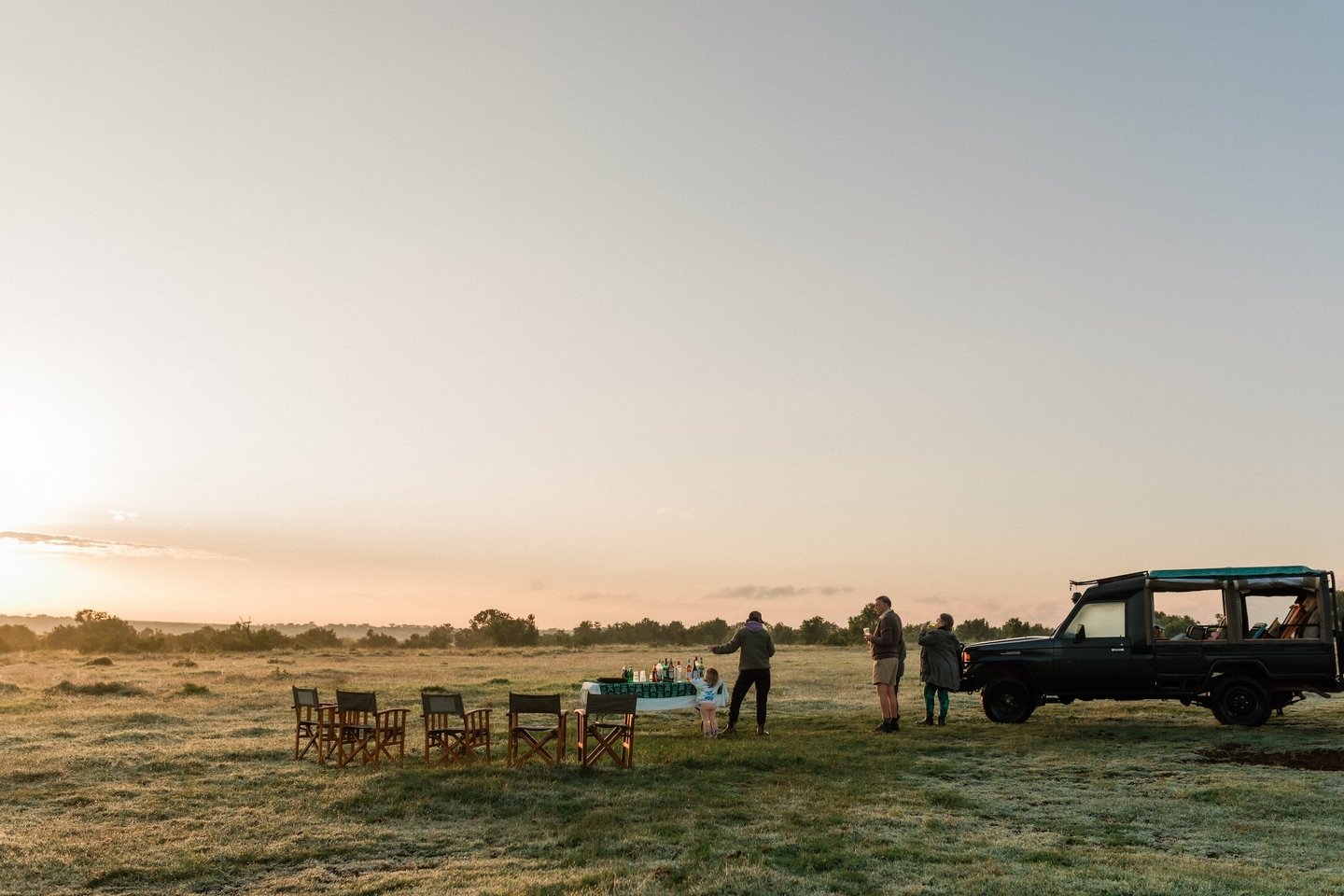 A sundowner is, in theory, a drink at sunset.

In reality, it's your guide pulling the vehicle off the track at exactly the right moment, in exactly the right spot, with the sky doing something you couldn't have planned. It's a cool drink in a warm h