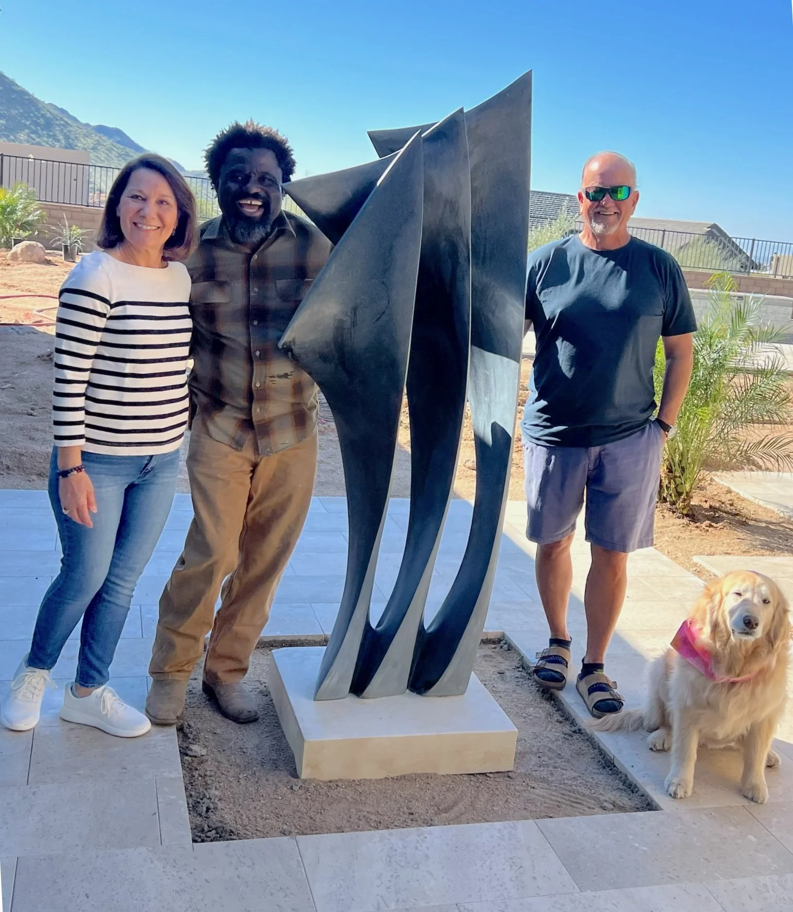 Gedion and Clients at sculpture installation at their new home.jpg