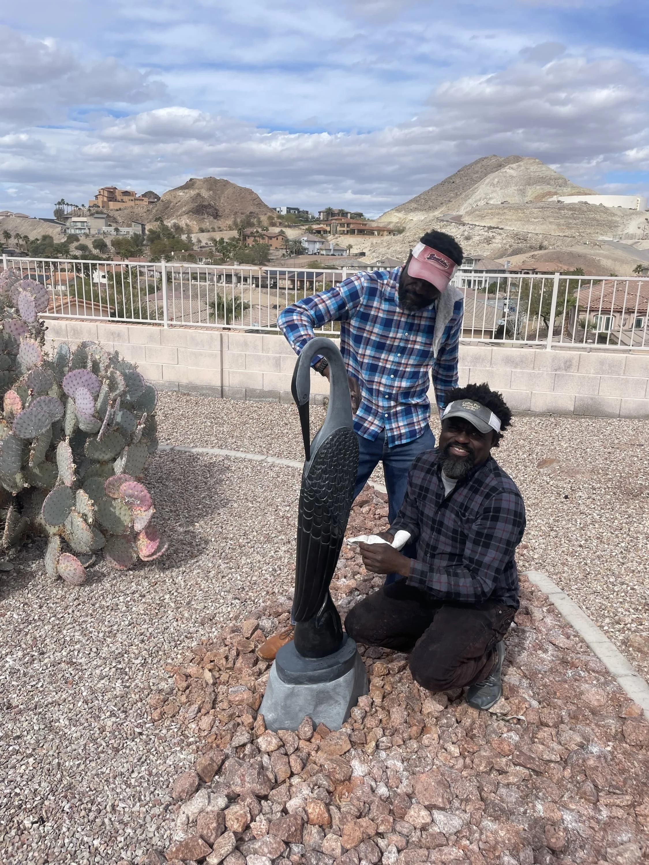 Gedion and his Brother Installing a sculpture in clients home in Las Vegas.jpeg