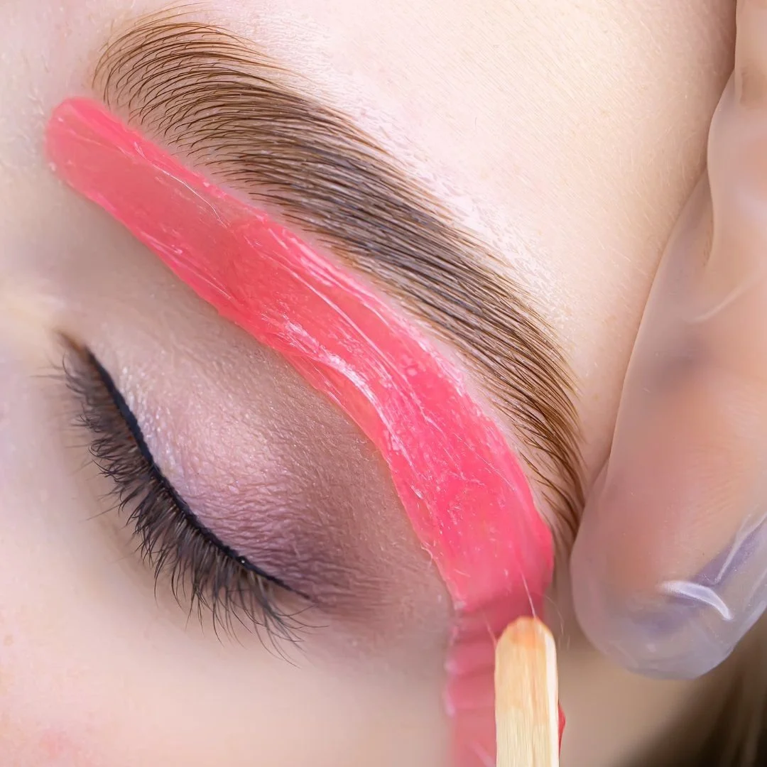 Pink wax being applied for a brow wax at Dollface in Oakville